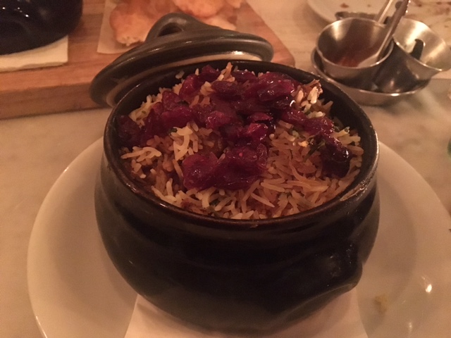 a bowl of rice with cranberries