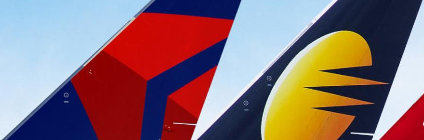 close-up of a red and blue tail fin of an airplane