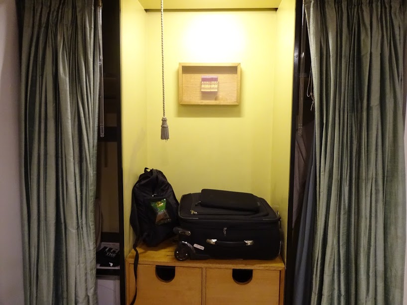 a suitcase on a shelf in a room