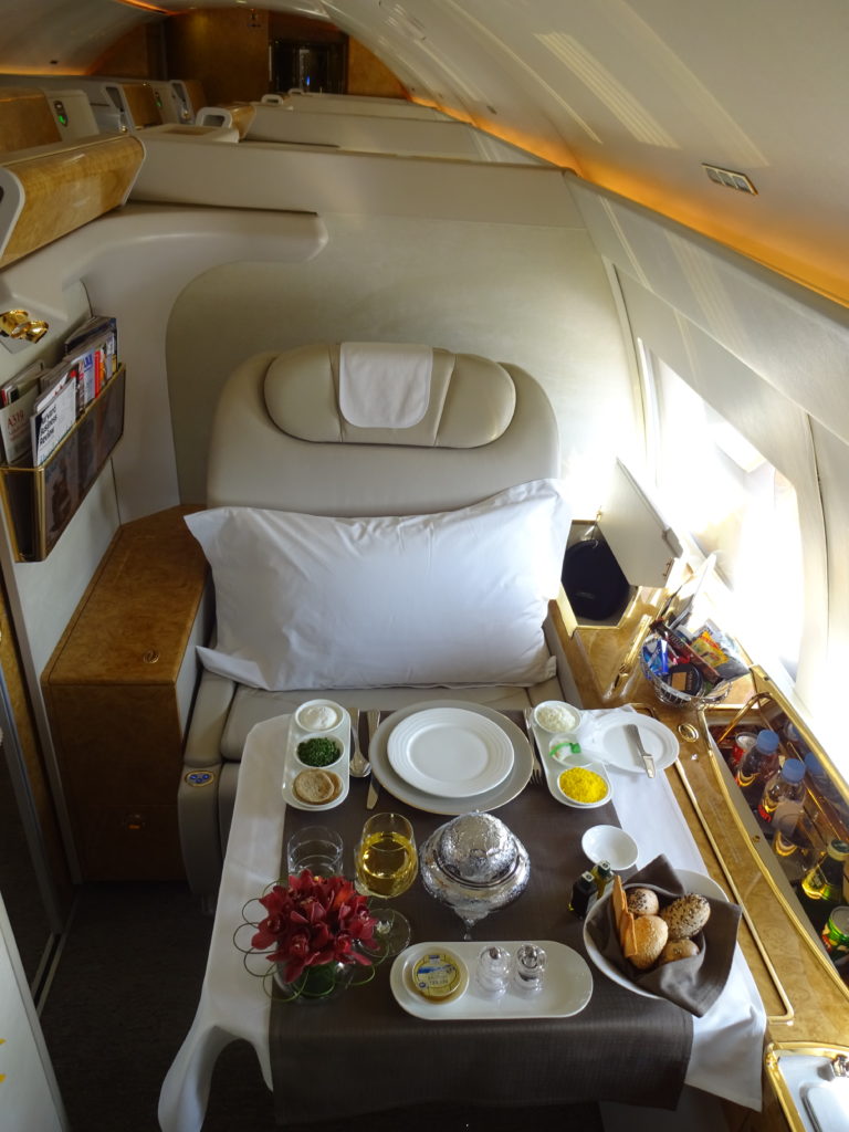a table with food on it in a plane