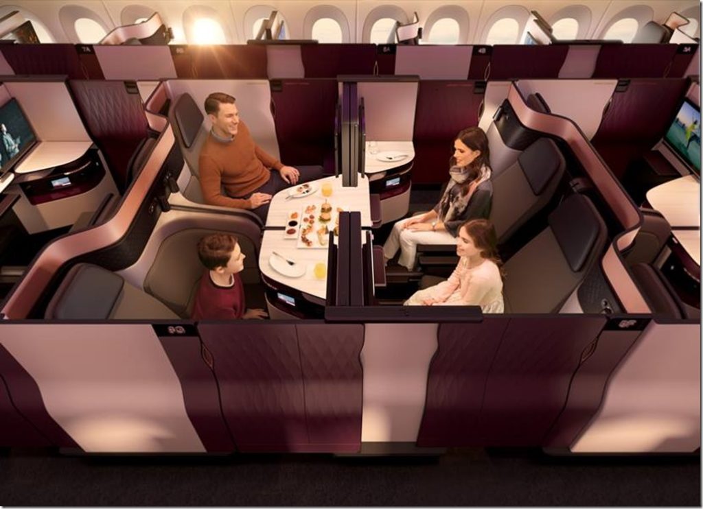 a family sitting at a table in a plane