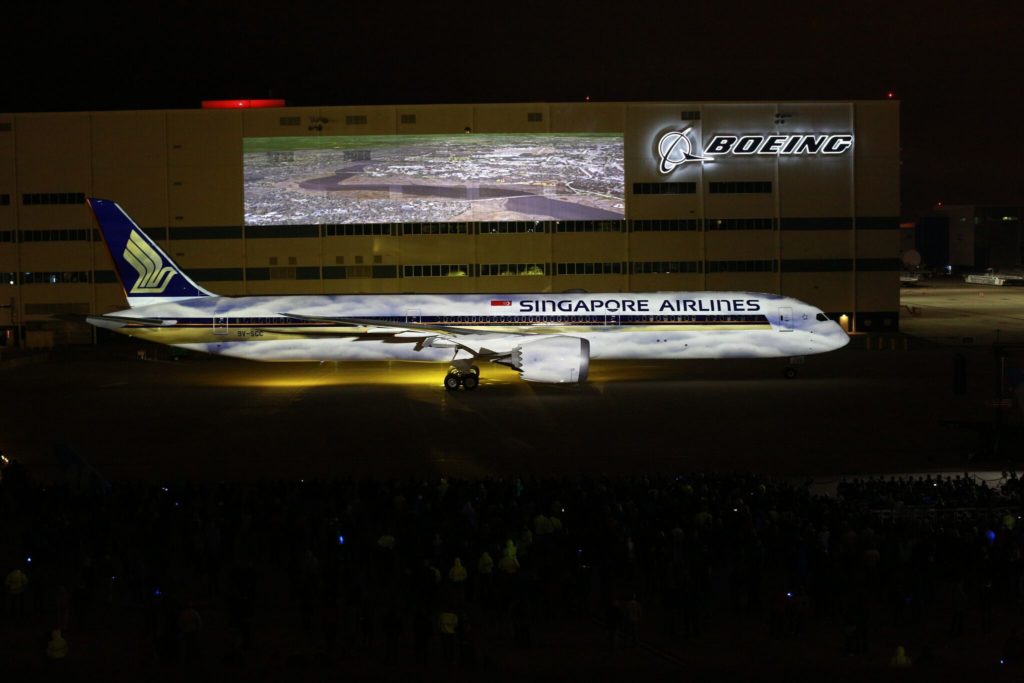 a large airplane with a large screen in front of it