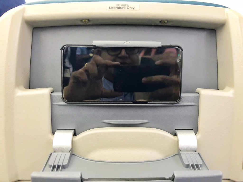 a phone in the back of a seat