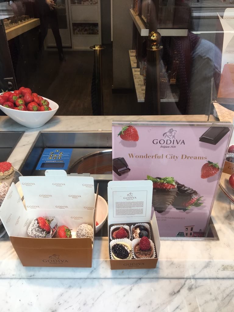 a display of chocolates and strawberries