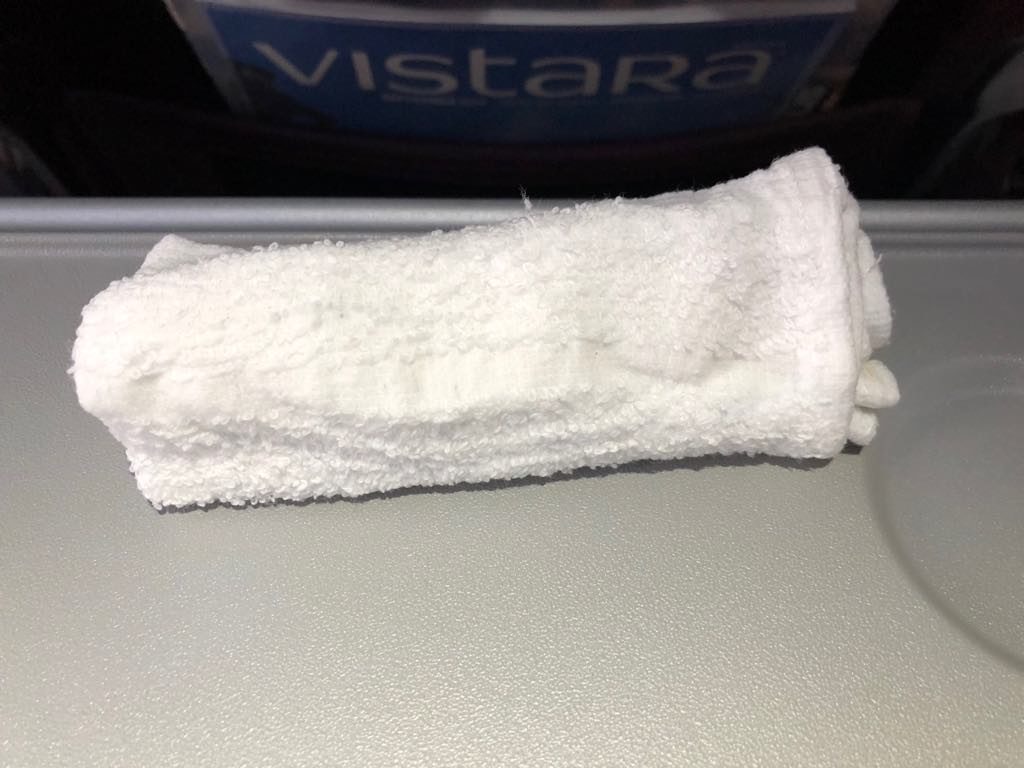 a white towel on a grey surface