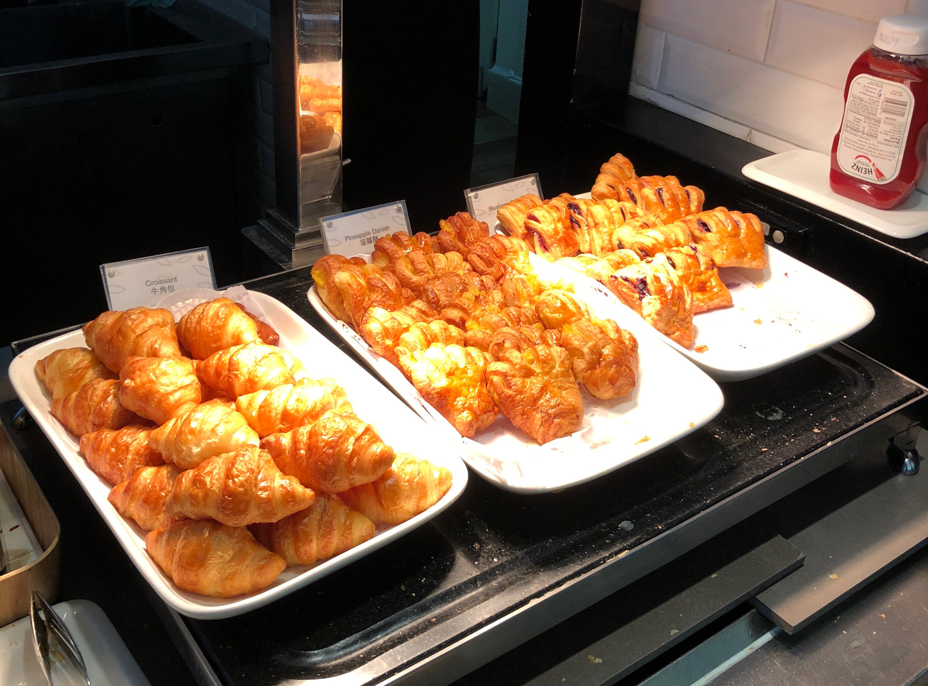 a group of croissants on plates