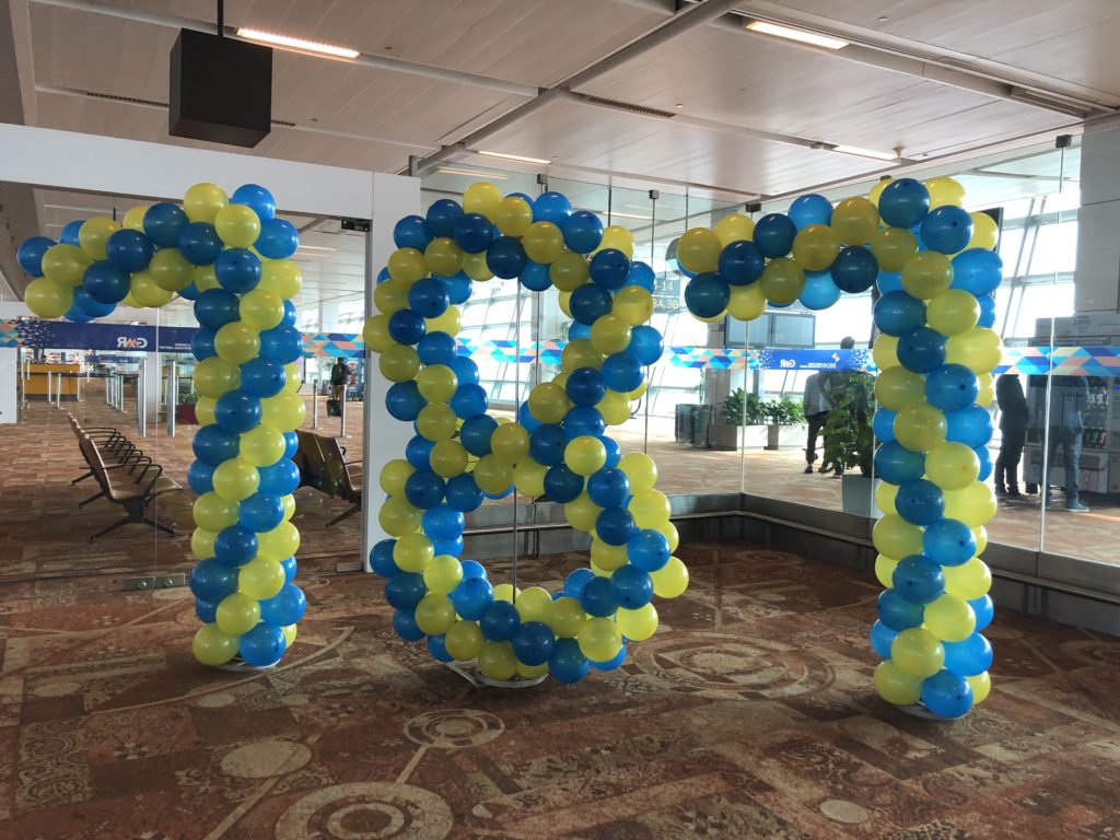 balloons in a room with a number made of balloons