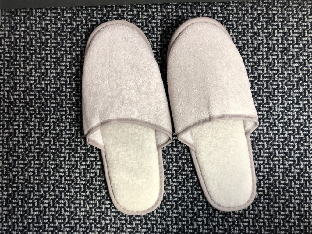 a pair of slippers on a carpet