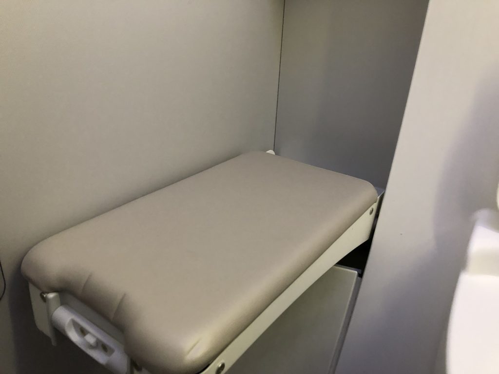 a white chair in a white cabinet