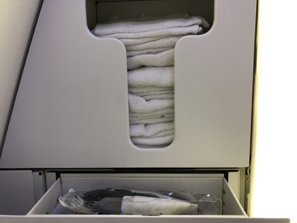 a drawer with a stack of towels