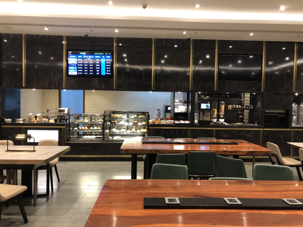 a restaurant with a counter and a display