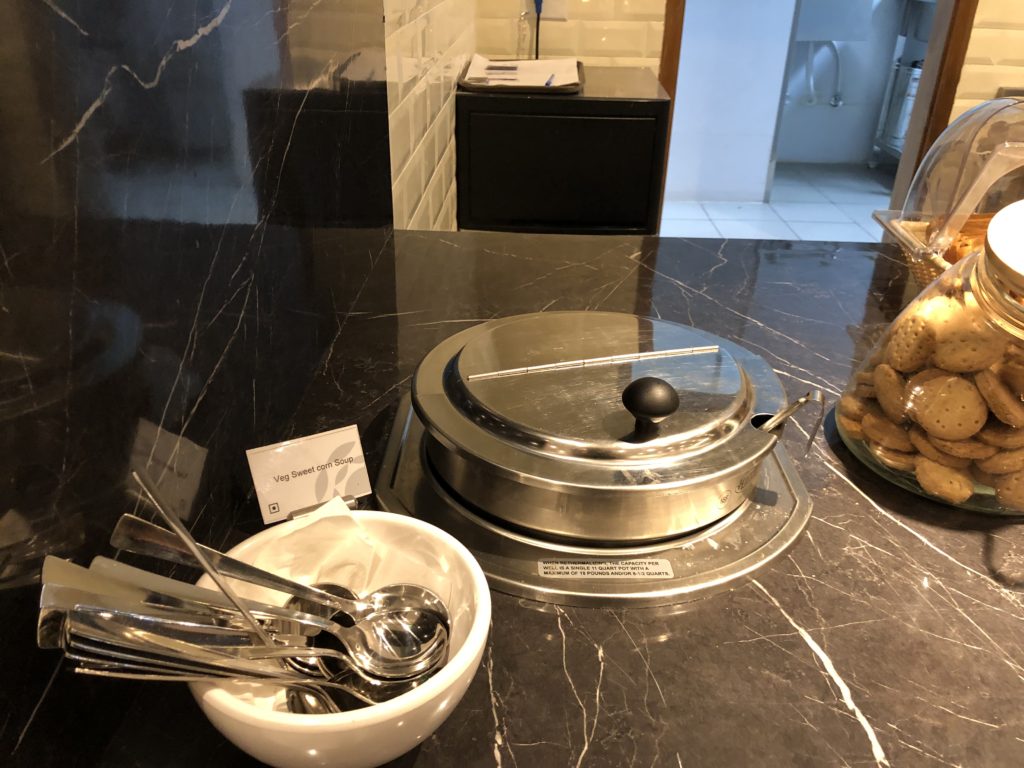 a bowl of spoons and bowls on a counter