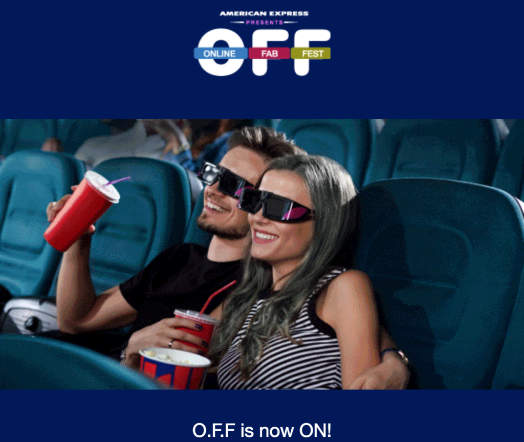 a man and woman in 3d glasses sitting in a movie theater