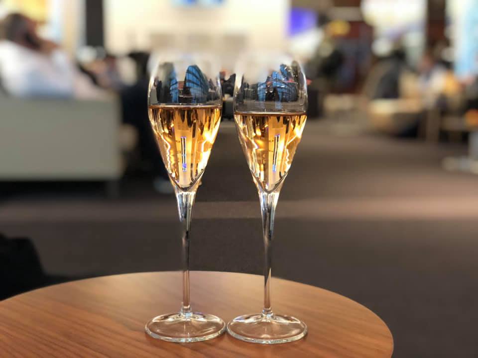 Airport lounge champagne A First Class Honeymoon Upgrade