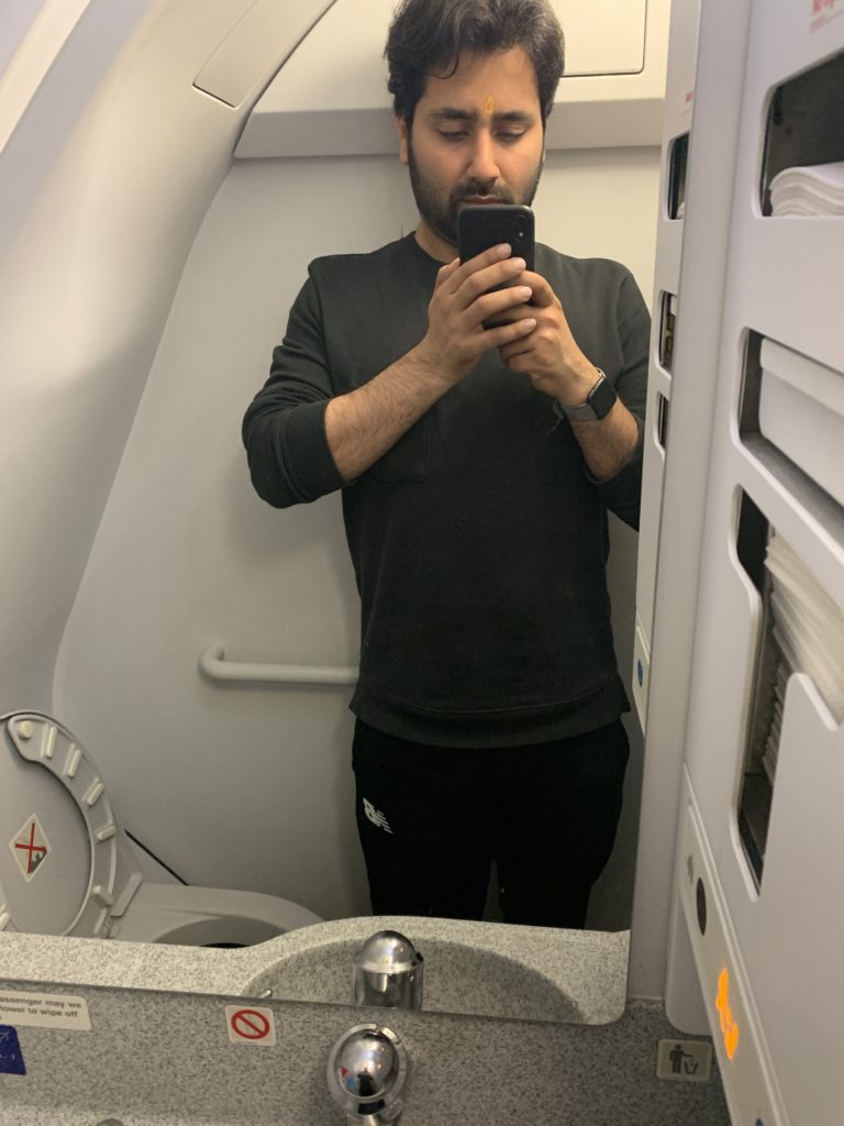 a man taking a selfie in a plane