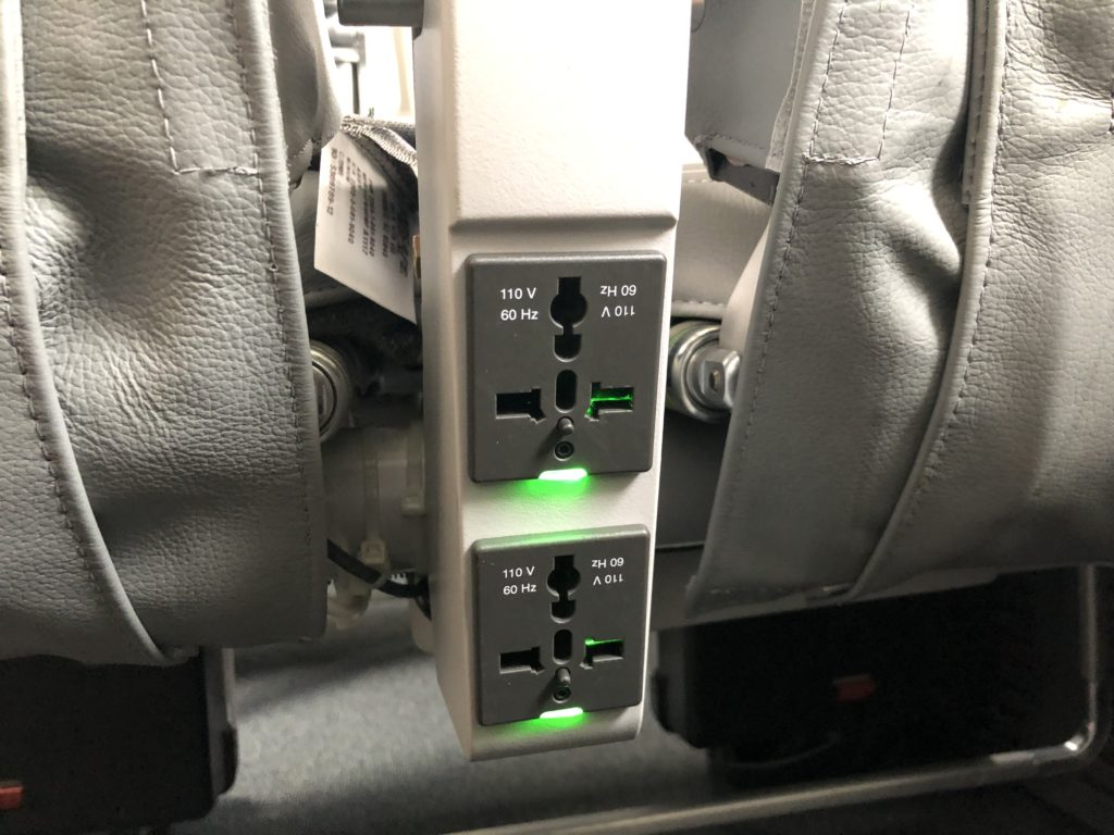 a power strip with green lights