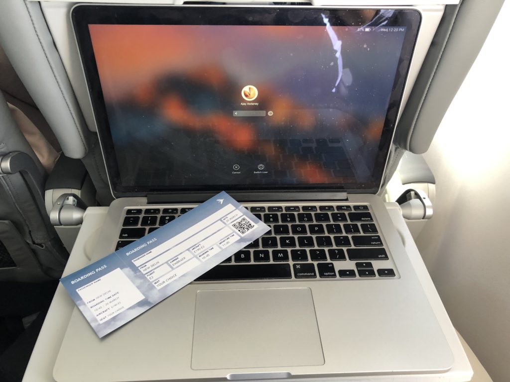 a laptop with a ticket on the front