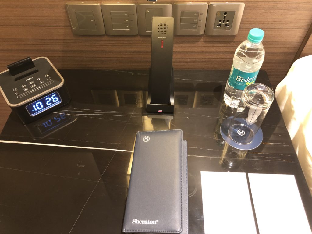 a phone and a wallet on a table