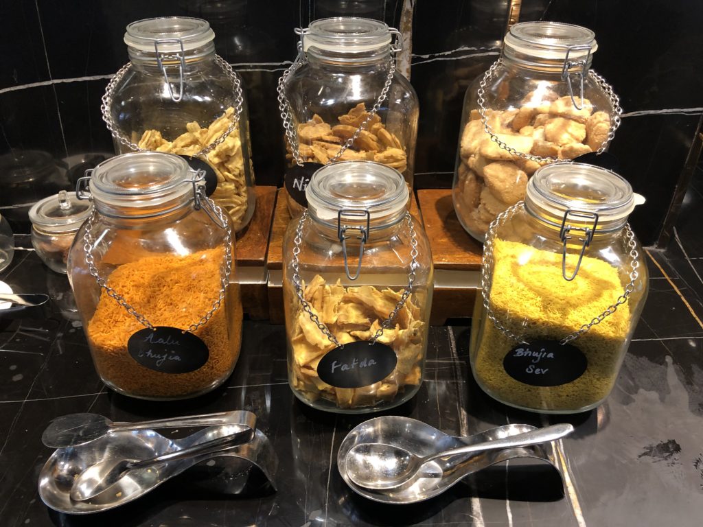 a group of glass jars with different types of food in them