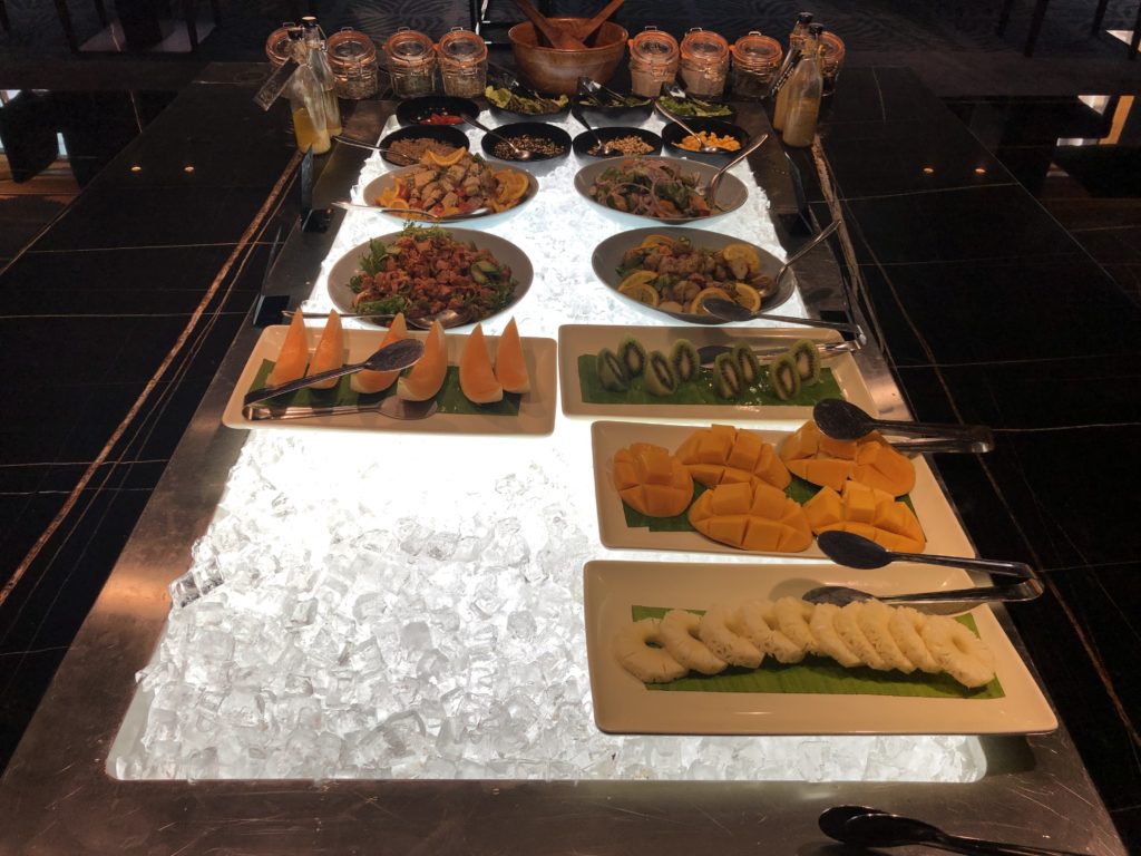 a buffet table with plates of food on it