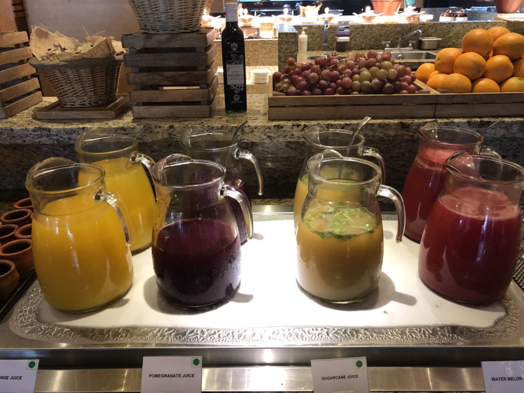 a group of glasses of juice