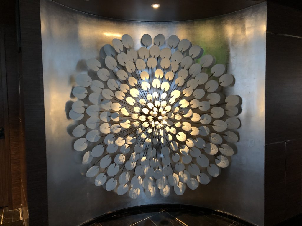 a circular light fixture on a wall