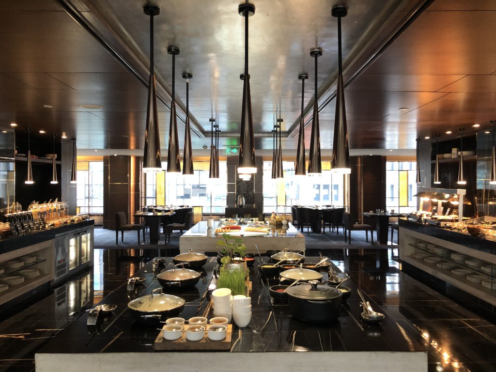 a large room with a large kitchen and a large table with food