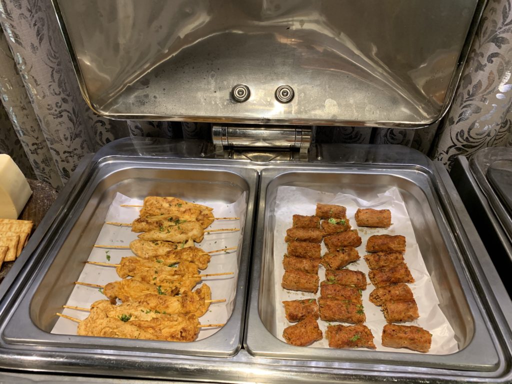 a trays of food in a buffet