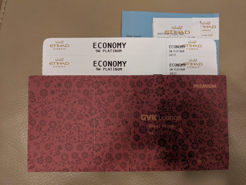 a red envelope with tickets inside