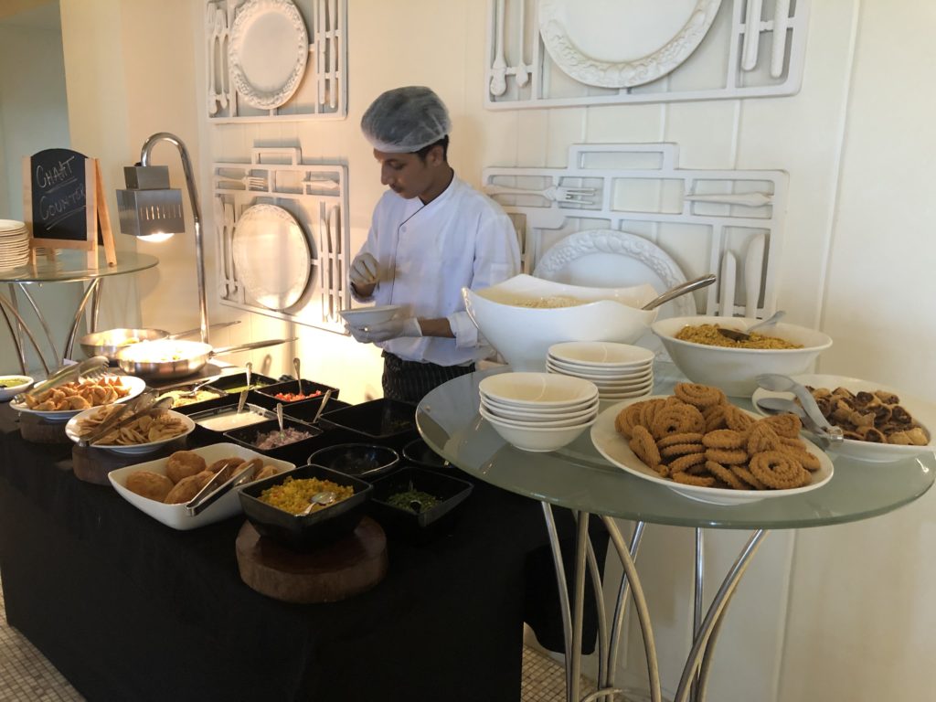 a man standing in front of a buffet table
