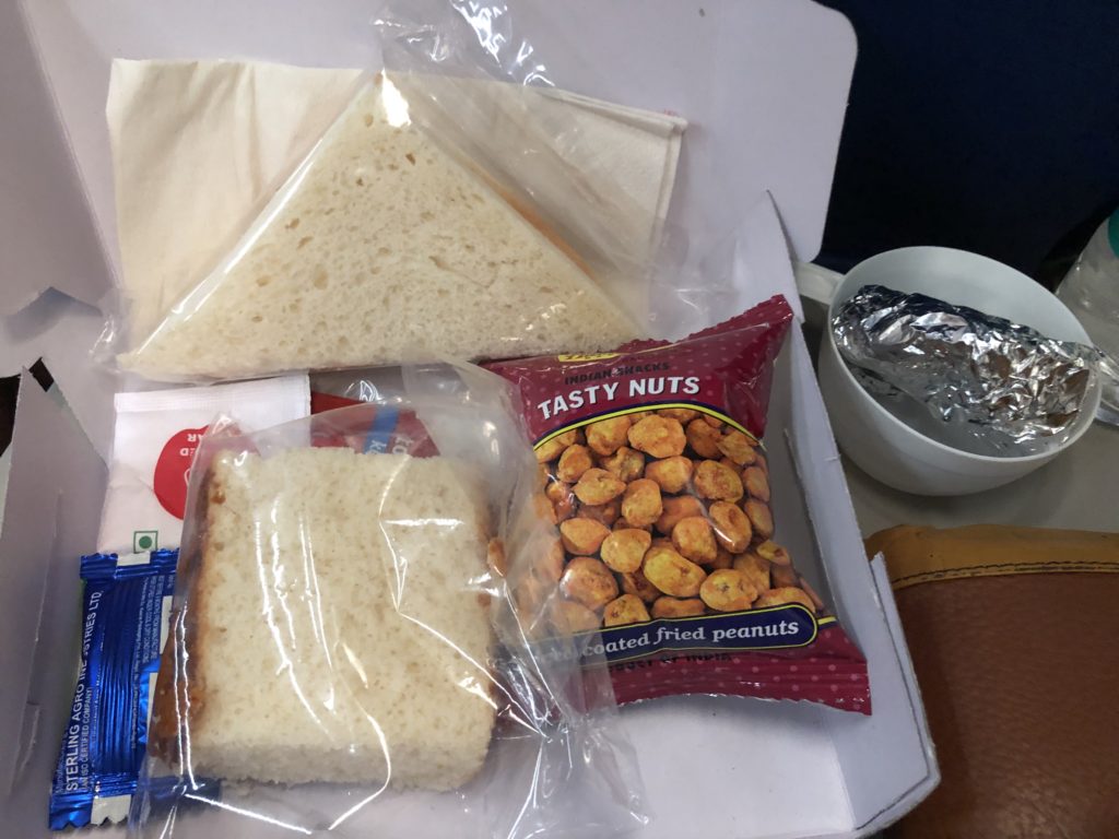 a sandwich and crackers in a plastic bag