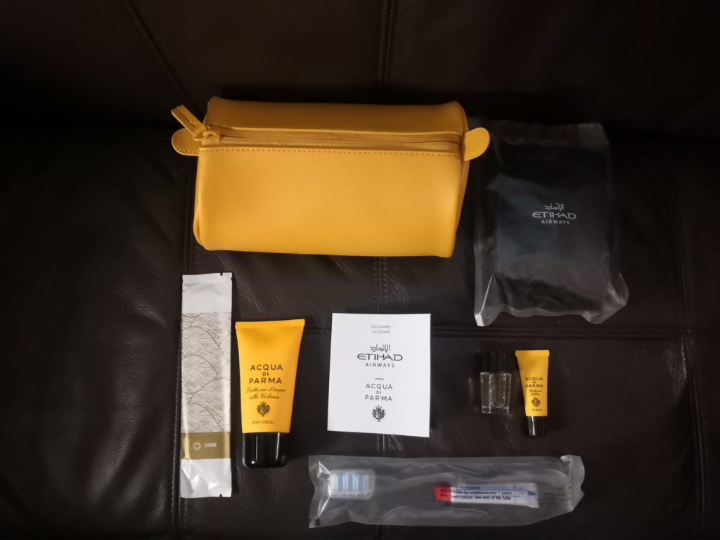 a small yellow bag with small objects on it