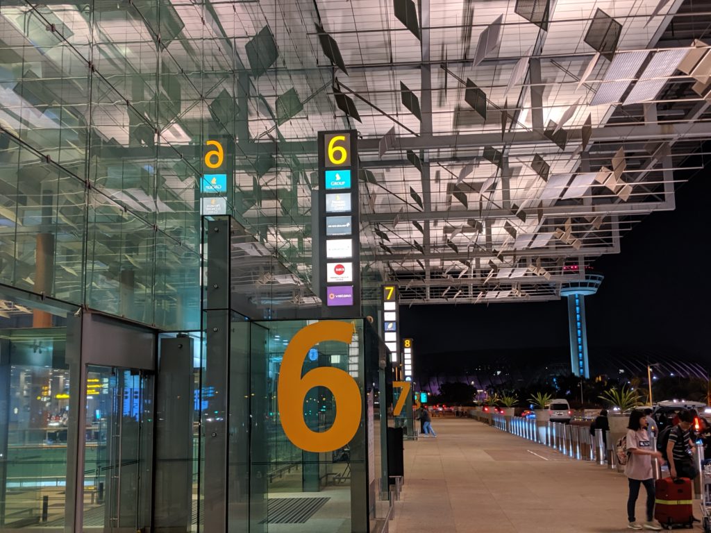 a glass building with signs and numbers