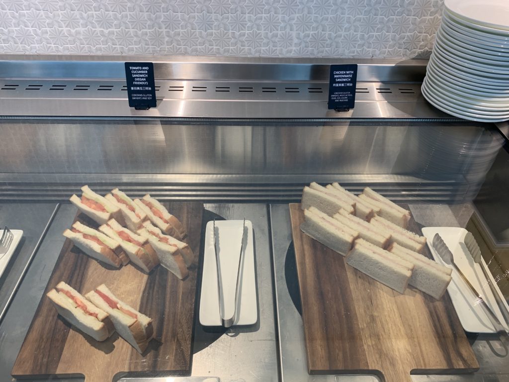 sandwiches on cutting boards on a counter