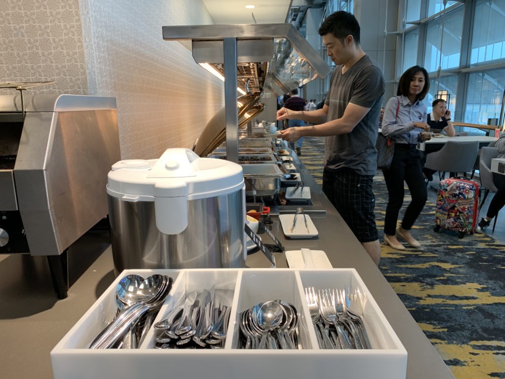 a man standing in front of a buffet