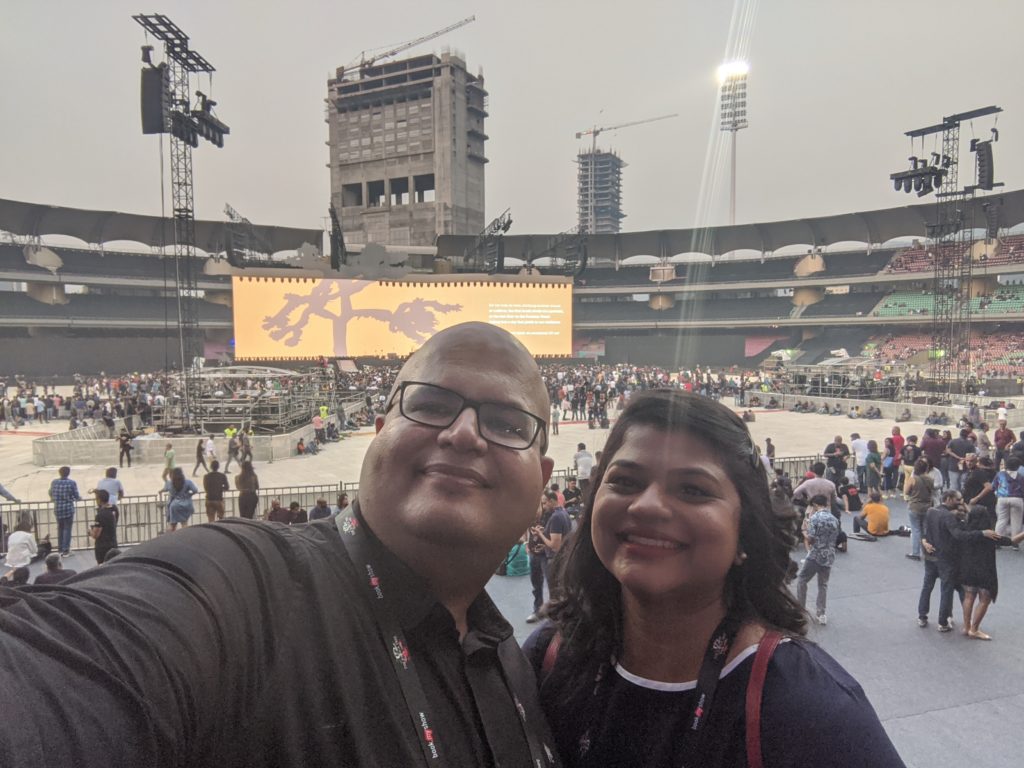 a man and woman taking a selfie in a stadium