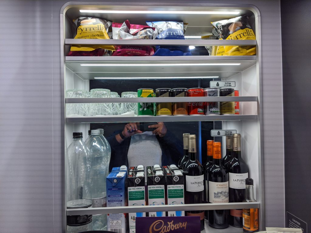 a refrigerator with a person behind it