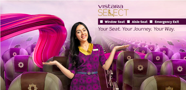 a woman in purple dress standing in an airplane