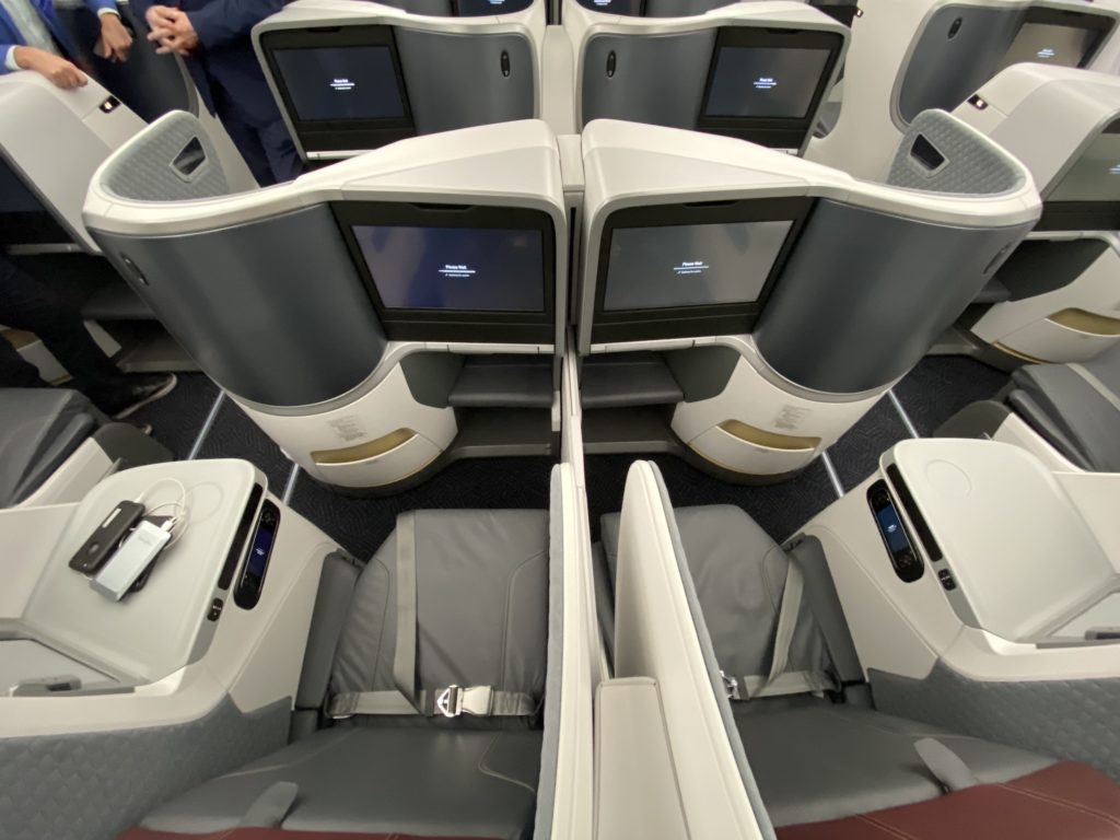 a group of seats with monitors